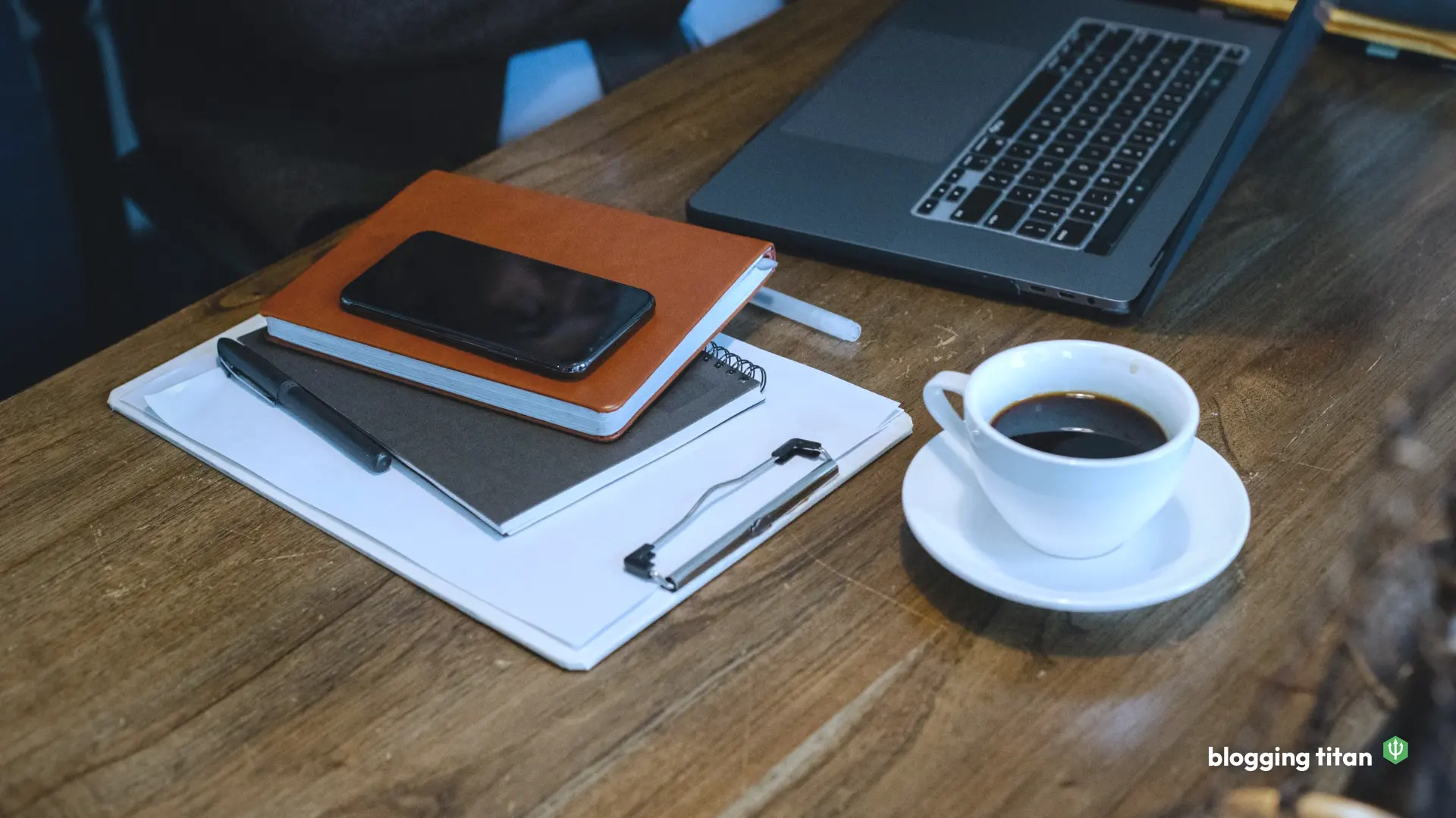 Documentary desk photograph used as the featured image for elegant themes review - Blogging Titan