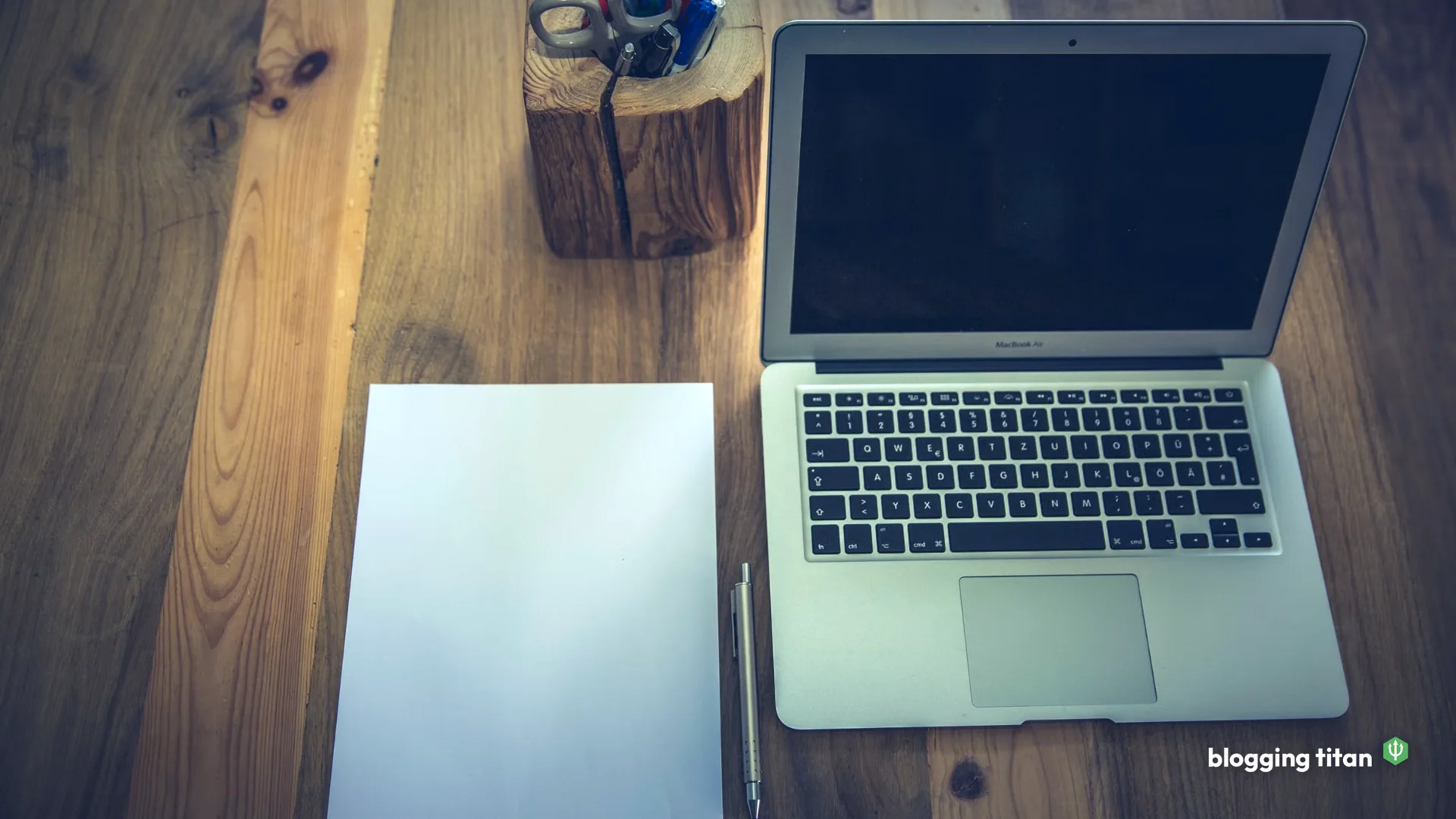 Documentary desk photograph used as the featured image for hidden costs of free blogging - Blogging Titan